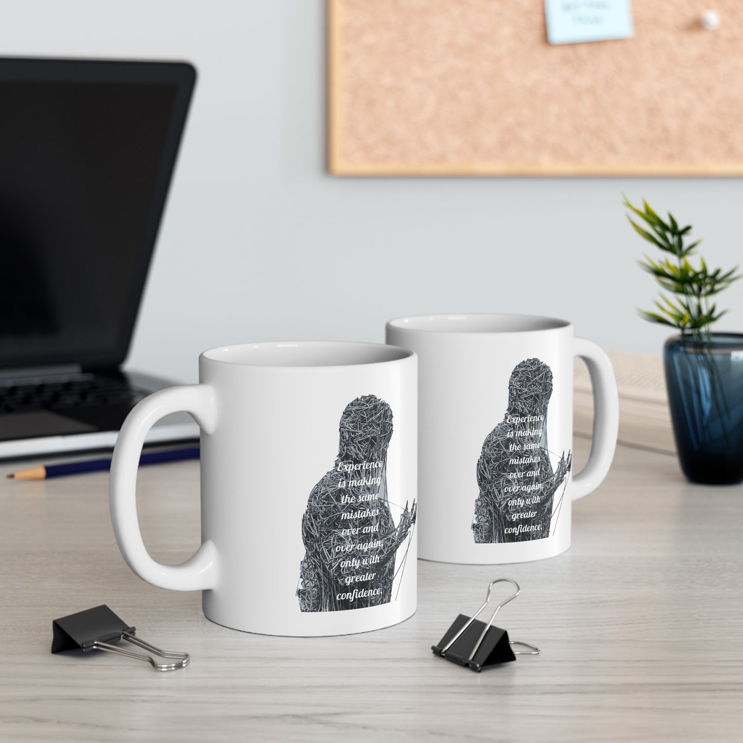 Left and right view of graphic "Experience is making the same mistakes" monster on white mugs.