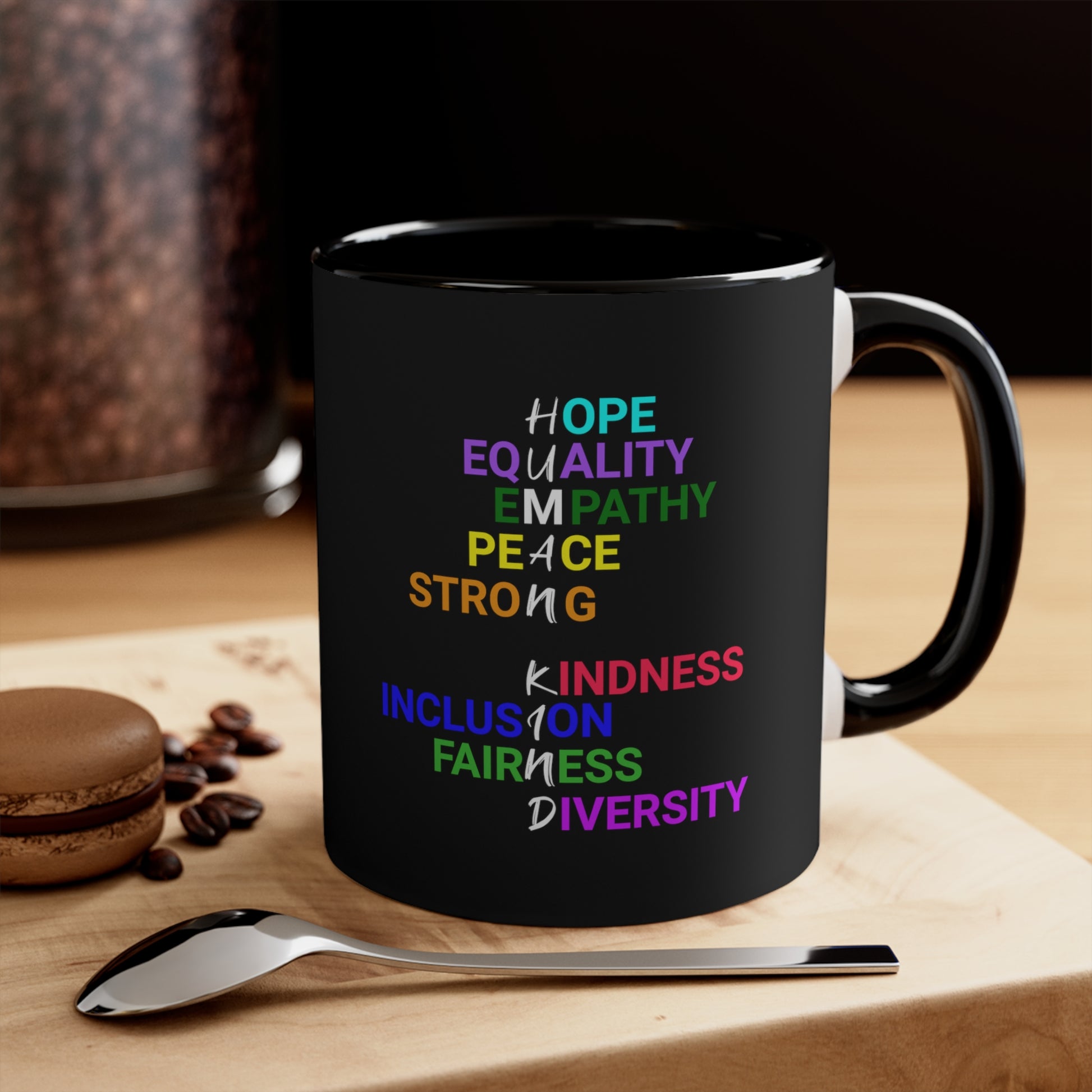 Black mug with graphic "Human Kind"