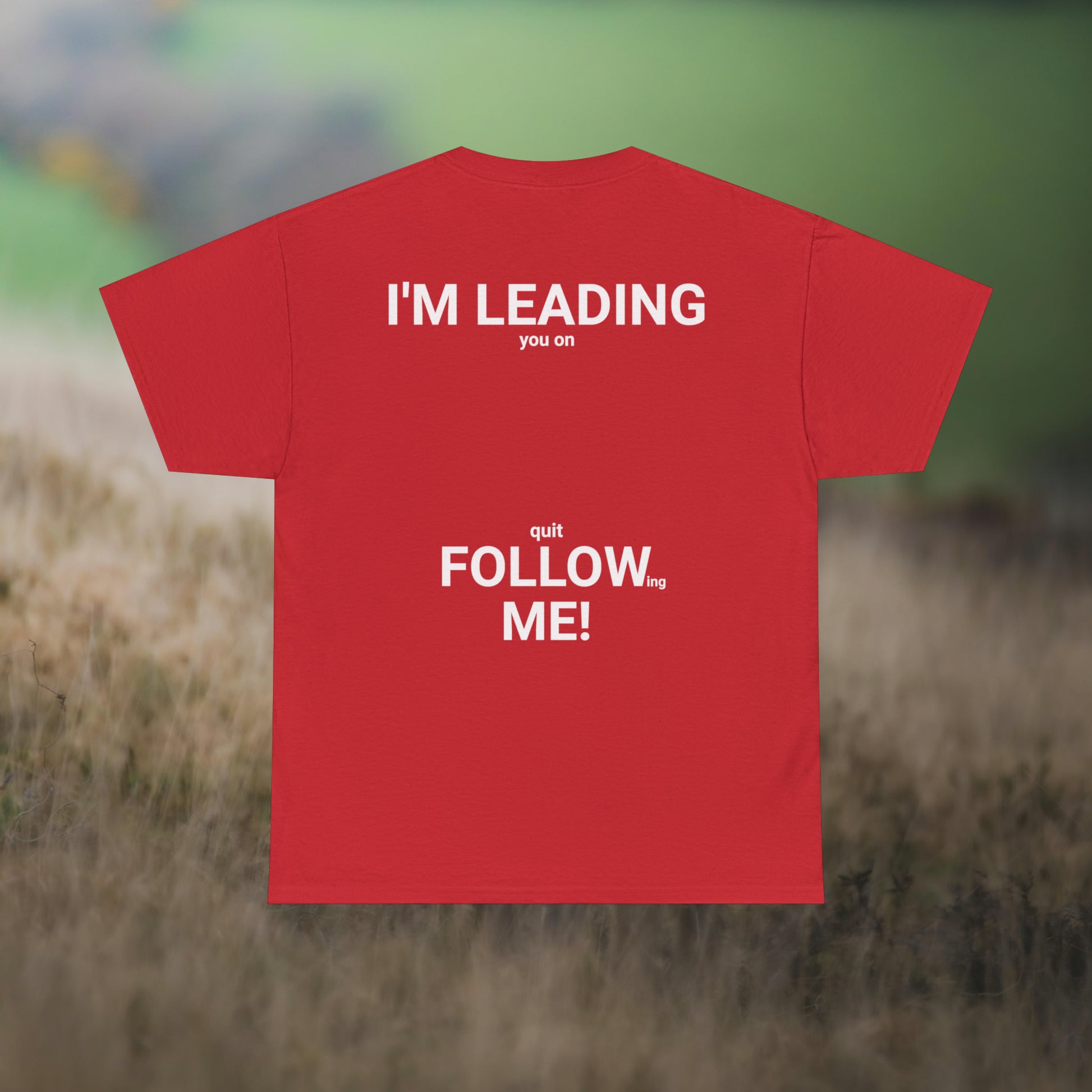 Red tee's back, with graphic "I'm leading you on, quit following me!" on a field background.