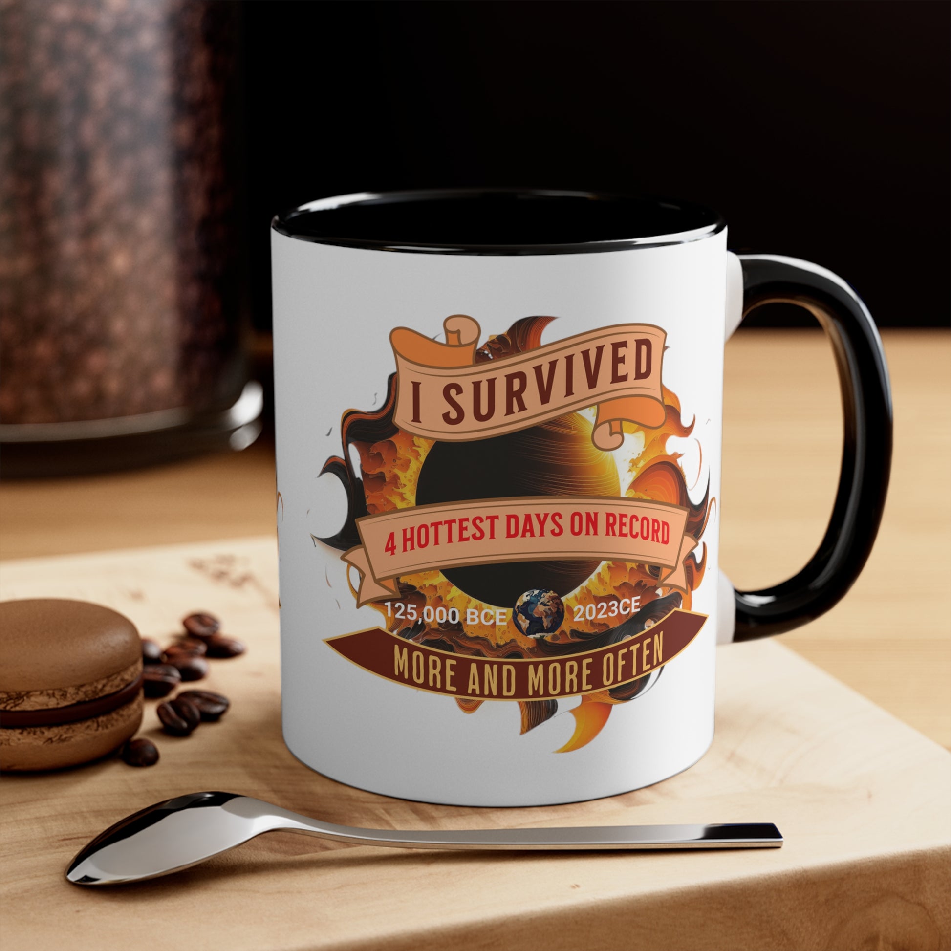 Black interior and handle on a white mug white graphic for "I survived the four hottest days" sitting on a woodblock near a spoon and cookie