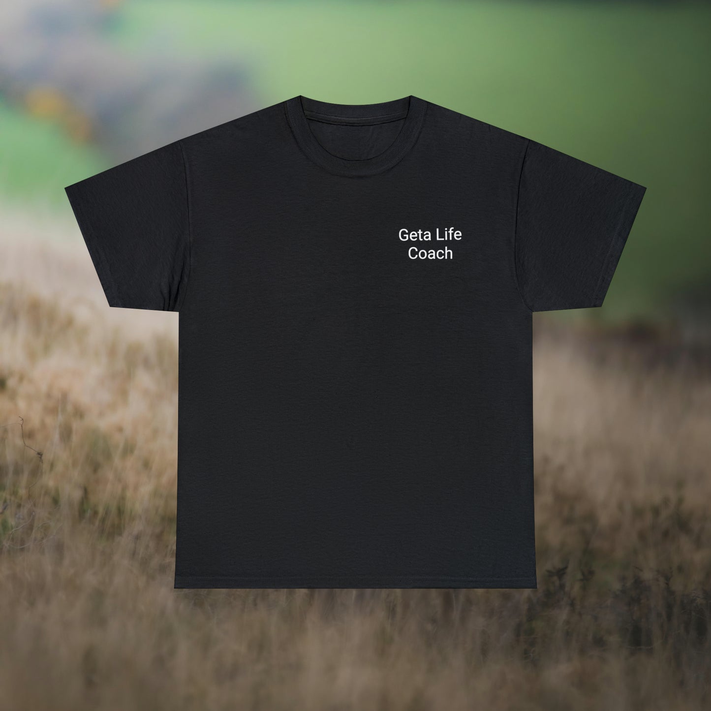 Black tee for "Geta Life Coach (don't) Follow Me!" on a field background.