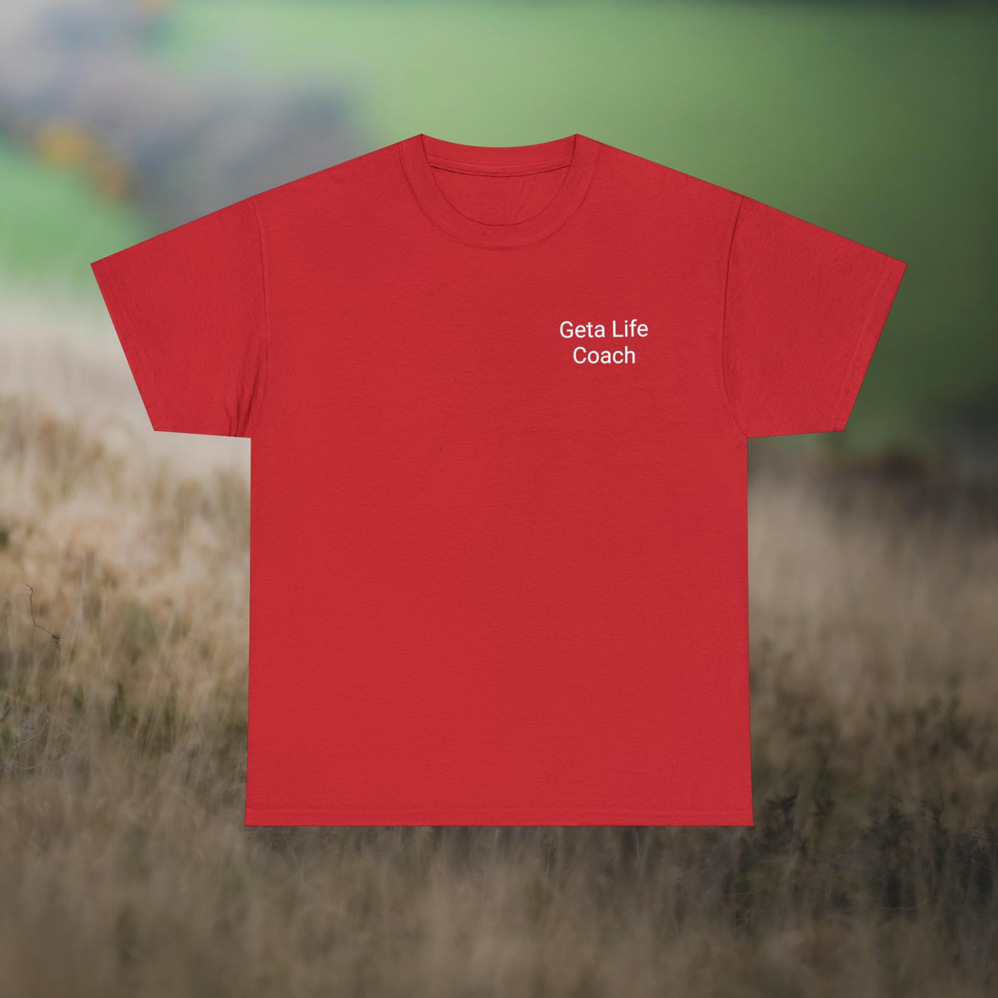 Red tee for "Geta Life Coach (don't) Follow Me!" on a field background.