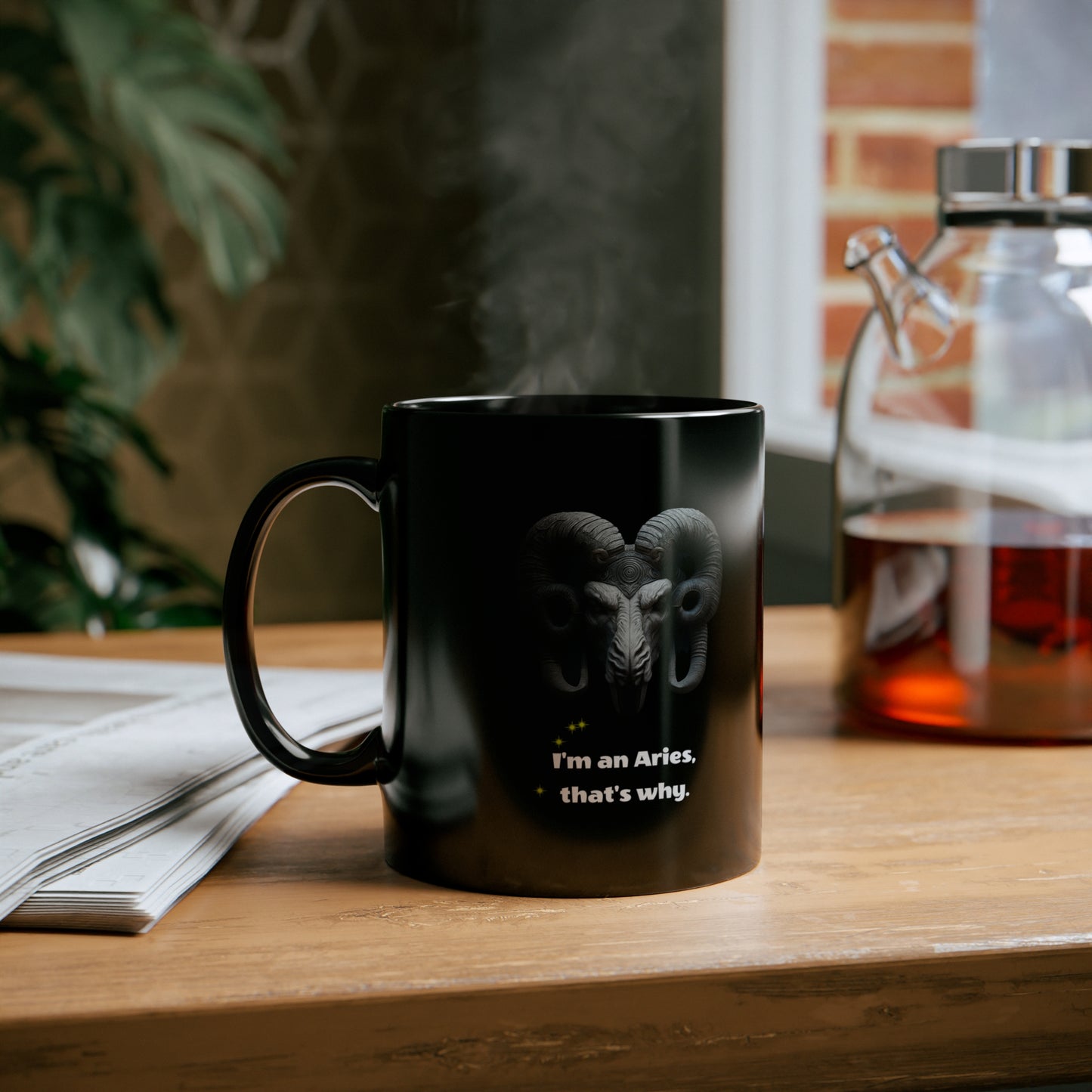 Black mug with graphic of Ram figure "I'm an Aries, that's why,"on a wood tabletop