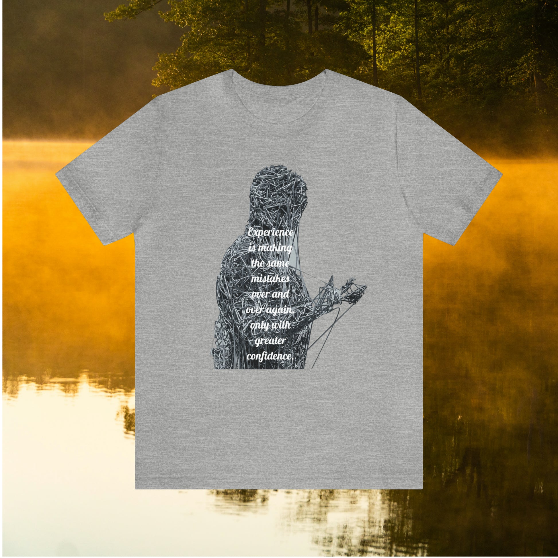 Grey tee on golden pond background with "Experience is making the same mistakes" monster graphic"