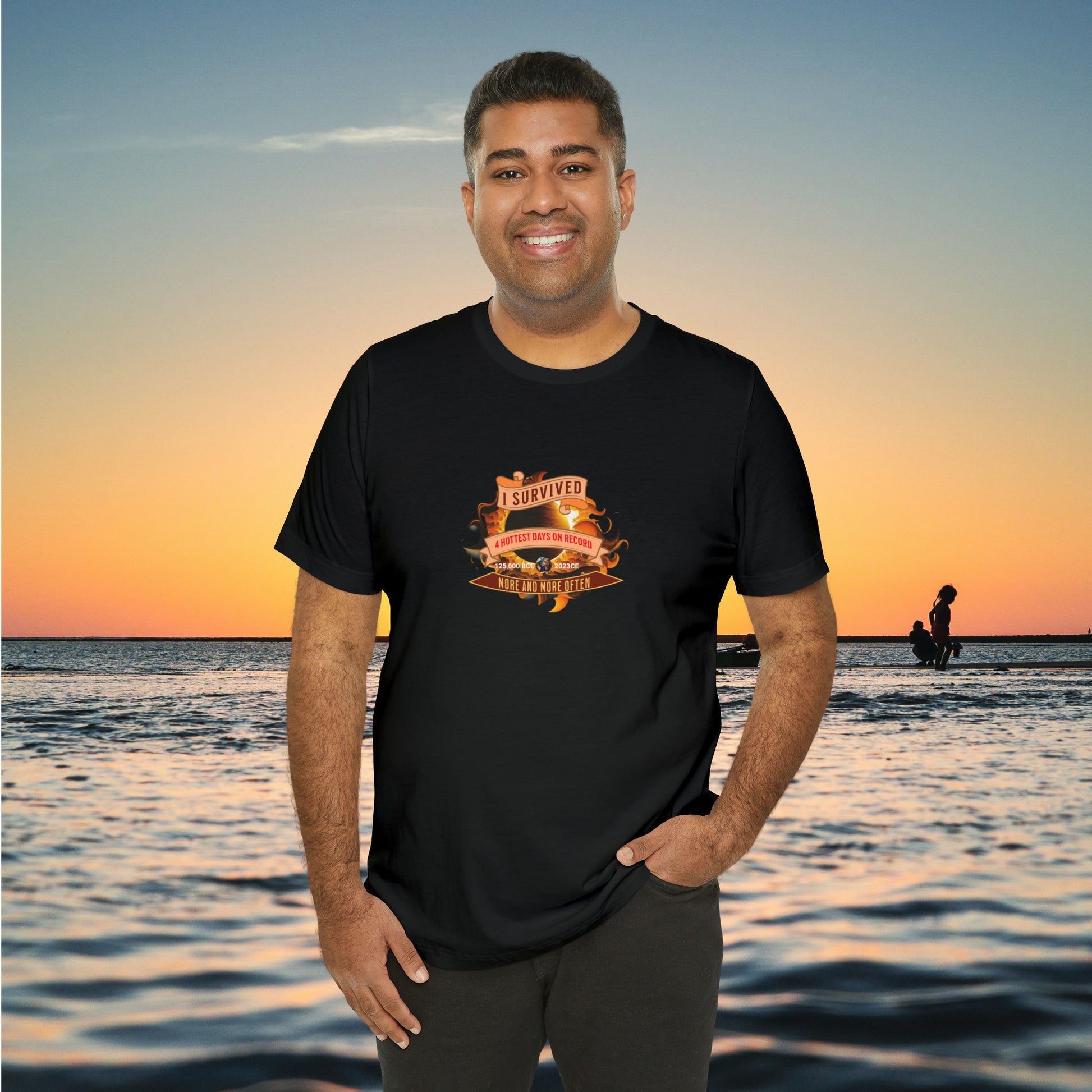 Man wearing a blck tee with graphic for "I Survived..."with ocean background