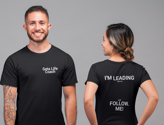 Front view of man in black tee, back view of women in black tee, graphics "Geta Life Coach (don't) Follow Me!"