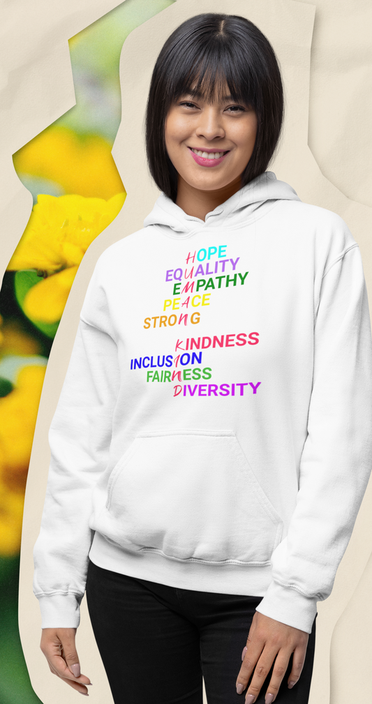 Smillng woman in white hoodie with graphic "Human Kind"