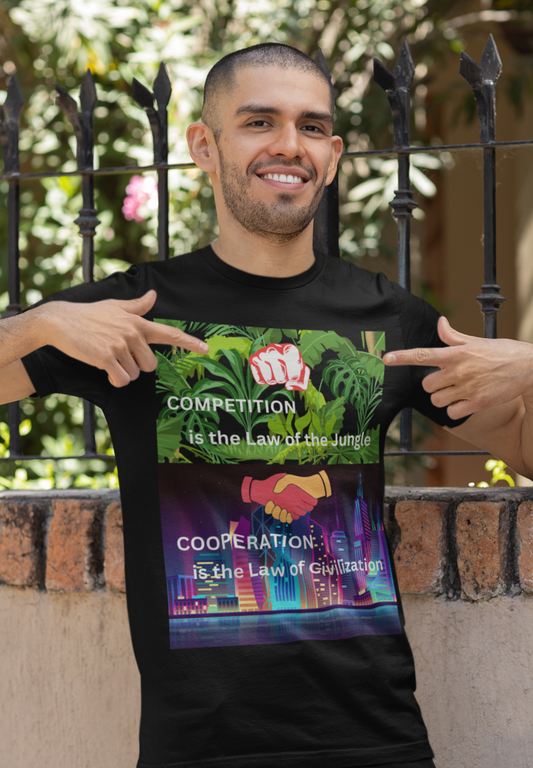 Young man pointing to his black tee with graphic "Cooperation" vs Competition"