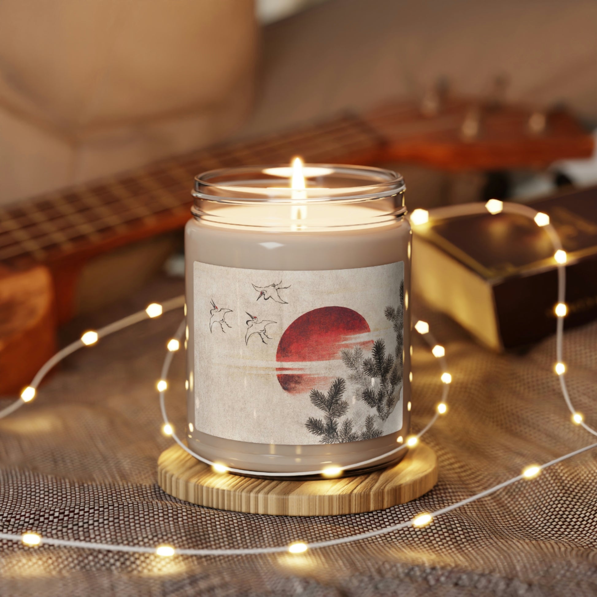 "Clean Cotton" Scented Soy Candle  jar with Hokusai print 'birds and sunset' on table with white LED chain