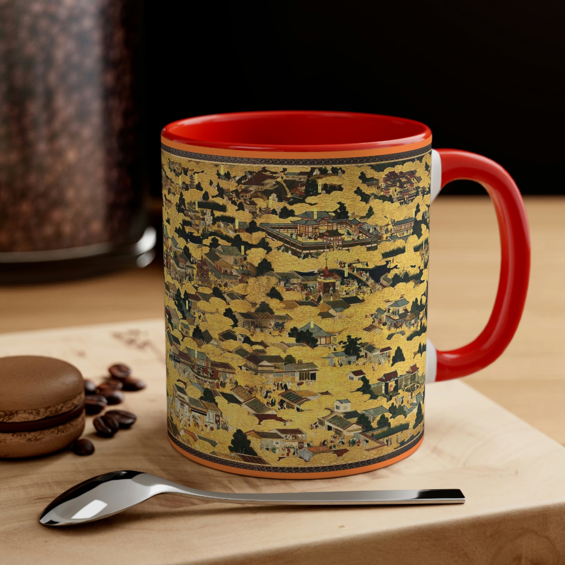 "Kyoto Map" (Vintage 17th c.) on mug with orange color inside and on handle, sitting on a wood table by a spoon and cookie